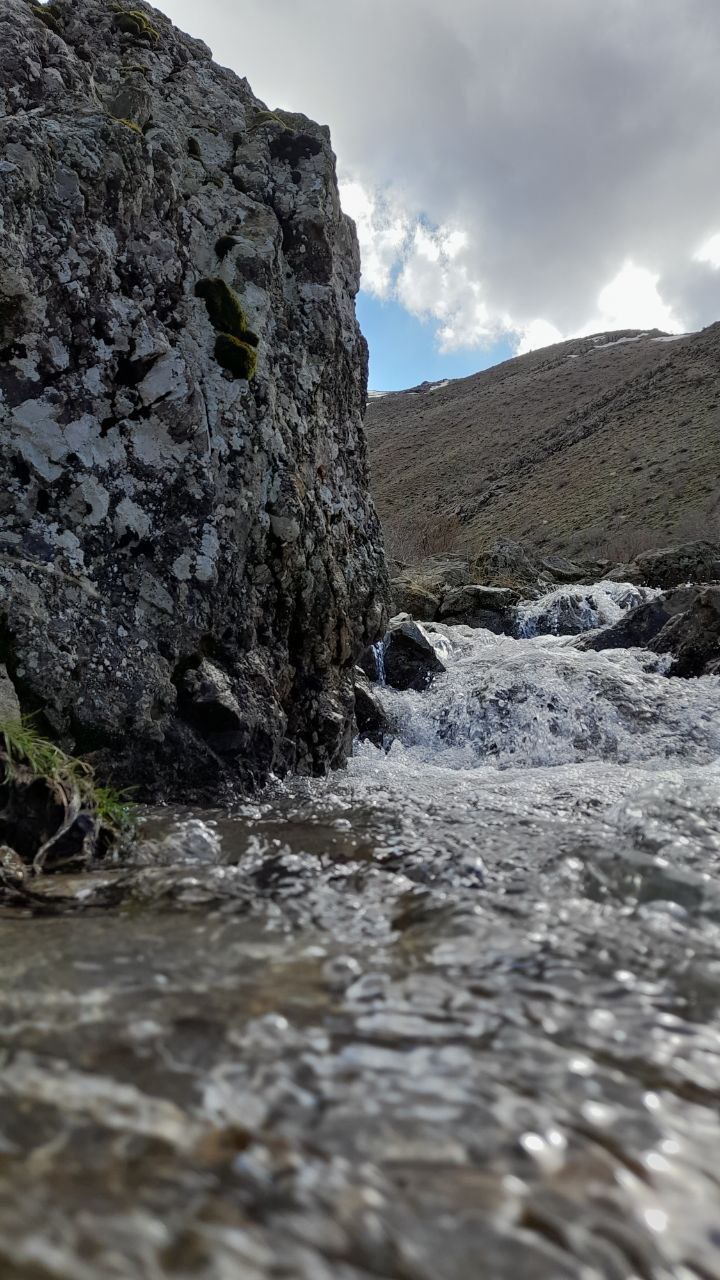a river running between rocky hills